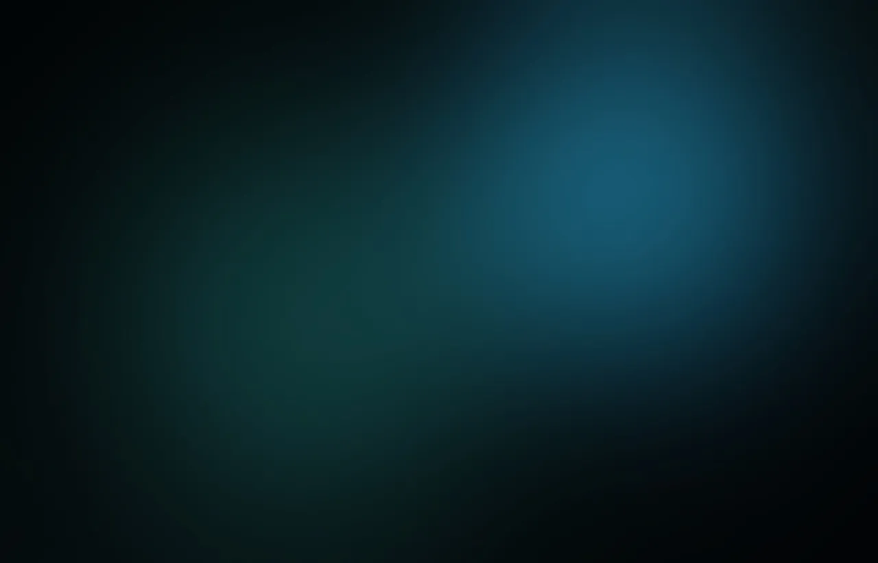 Muted teal and blue abstract light glowing calmly across a dark, textured surface