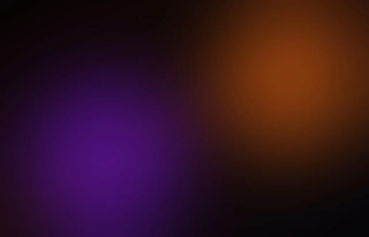 Warm orange and cool violet abstract light split across two distinct dark panels
