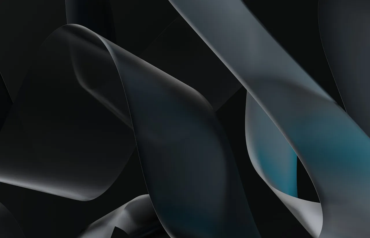 Dark folded ribbons curving past one another with a single teal highlight