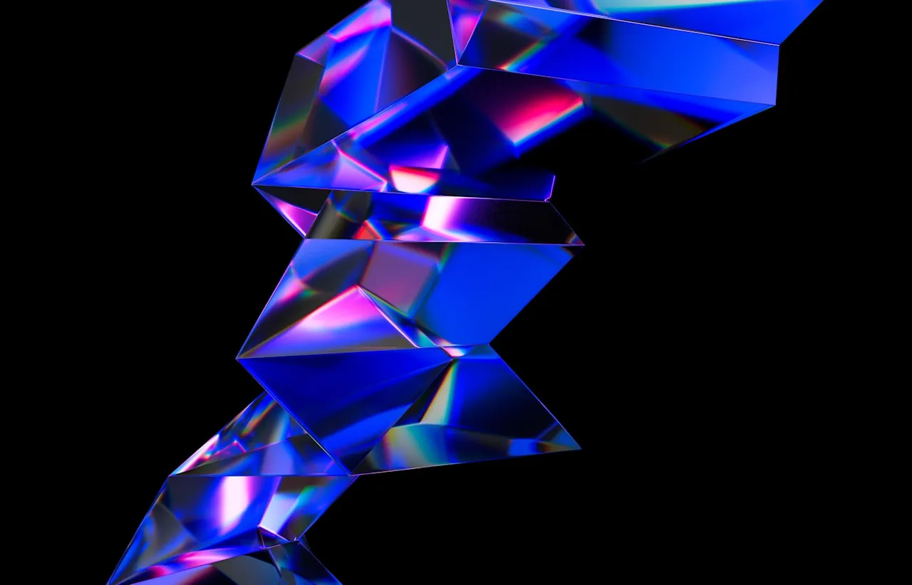 Faceted blue and violet crystal shards refracting light against a black background