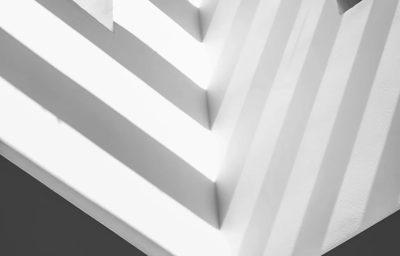 Abstract architectural lines in light and shadow, representing structured web platform architecture